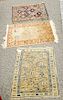 Three piece lot to include two Caucasian mats and a silk prayer rug.  (1'10" x 2'4"), (2' x 2'5"), and (1'8" x 2')