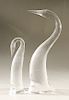 Pair of Steuben glass herons, crystal bird sculptures, signed on bottom: Steuben.  ht. 14 in. & ht. 9 1/2 in.  Condition: talles...