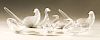 Seven piece Steuben glass bird group to include a pair of crystal ducks, three small goose or duck figures, and two glass doves or b...