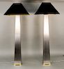 Pair of J. Robert Scott "Lithic" floor lamps, designed by Sally Sirkin Lewis, brushed stainless steel with polished brass base and c...