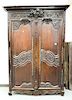 Louis XV oak armoire with large cornice molding over three dimensional fruit carving with two doors opening to shelves, 18th century...