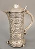 English silver ewer having overall embossed body on three round feet, having Christie's 1981 tag.  ht. 13 in.,  52 t oz.
