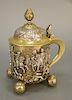 Covered tankard, gilt decorated with embossed scene of soldiers on horseback at battle area, possibly Napoleon, on ball feet, with G...