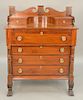 Mahogany Sheraton chest with backsplash, carved columns and paw feet, circa 1840.  ht. 55 in, wd. 41 1/2 in.