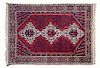 * A Persian Rug 83 1/2 x 59 1/2 inches.