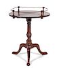 * A Chippendale Style Mahogany Tilt-Top Tea Table Height 30 x diameter 23 3/4 inches.