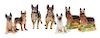 * A Group of Eight Porcelain German Shepherds Width of widest 9 1/4 inches.