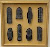 Set of eight black stone seals, having carved dragons, phoenix birds and one in the form of an urn with cover.  12 1/4" x 12 1/2"
