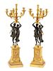 A Pair of Empire Style Gilt and Patinated Bronze Candelabra Height 38 inches.