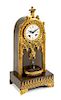 A Charles X Gilt and Patinated Bronze Fountain Clock Height 14 5/8 inches.