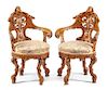 A Pair of Venetian Carved Armchairs Height 36 inches.