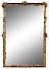 An Italian Baroque Style Giltwood Mirror Height 84 x width 54 inches.