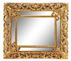 An Italian Rococo Style Giltwood Mirror Height 49 x width 57 inches.