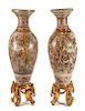 A Monumental Pair of Japanese Satsuma Porcelain Vases Height of vase 57 1/2 inches.