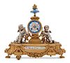 * A French Porcelain Mounted Gilt and Silvered Bronze Mantel Clock Height 14 x width 12 1/2 x depth 3 inches.