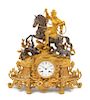 * A French Parcel Gilt Cast Metal Mantel Clock Height 18 1/2 x width 15 1/2 x depth 4 inches.