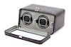 A Wolf Dual Operation Watch Winder Height of case 8 x width 11 1/2 x depth 5 1/2 inches.