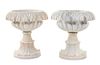 A Pair of Carved Marble Urns Height 21 inches.