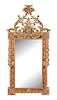 An Italian Louis XV Style Giltwood Mirror Height 69 x width 34 inches.