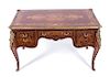 A Louis XV Style Gilt Bronze Mounted Marquetry Writing Table Height 32 1/2 x width 54 x depth 32 inches.