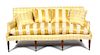 A Regency Style Silk Upholstered Sofa Height 37 x width 74 x depth 34 inches.