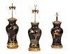 A Group of Three Ebonized and Parcel Gilt Table Lamps Height 22 inches.