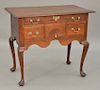 Queen Anne lowboy with molded top over one long drawer over three short drawers with fan carved center drawer over cyma skirt, all s...