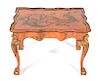 An Italian Painted and Parcel Gilt Side Table Height 19 1/2 x width 27 x depth 20 1/4 inches.
