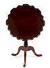 A George III Mahogany Tilt-Top Tea Table Height 30 x diameter of top 29 1/2 inches.