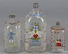 Three Stiegel-type enameled glass bottles, 19th c., 8'' h., 6'' h., and 5'' h.