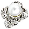 A cultured pearl and diamond palladium silver ring.