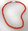 Coral beaded necklace featuring graduating