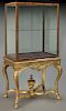 Curio cabinet on gilt gesso stand,
