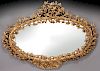 Italian wood carved and gilt mirror,