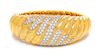 An 18 Karat Yellow Gold, Platinum, and Diamond Bangle Bracelet, Montreaux, 50.40 dwts.