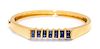 An 18 Karat Yellow Gold and Sapphire Bangle Bracelet, Montreaux, 21.10 dwts.