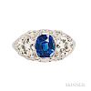 Art Deco Platinum, Sapphire, and Diamond Ring, set with a cushion-cut sapphire measuring approx. 7.10 x 6.00 x 4.97 mm, flanked by tran