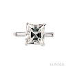 Platinum and Diamond Solitaire, prong-set with a fancy-cut diamond weighing 3.77 cts., flanked by baguettes, size 5 3/4.