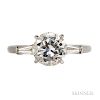 Platinum and Diamond Solitaire, prong-set with a full-cut diamond weighing approx. 1.87 cts., flanked by tapered baguettes, size 6.