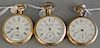 Three open face pocket watches, gold filled faces marked Waltham, Omega, and Elgin.