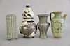 Four Chinese vases to include black and white double gourd vase with dragon, green glazed urn with handle, green glazed square vase,...