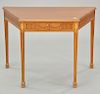 Margolis mahogany shaped top table. ht. 26 in., wd. 38 in., dp. 22 in.