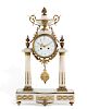 A Louis XVI style white marble mantel clock