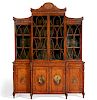 A Sheraton Revival painted satinwood bookcase