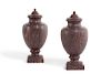 A pair of Egyptian porphyry urns
