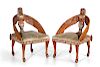 A pair of Egyptian Revival armchairs