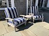 Pair of Gloster Teak Armchairs with Blue and White Cushions and Round Teak Table