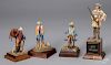 Four cast metal cowboy miniature figures