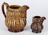 Two Bennington pottery flint enamel Rockingham glaze pitchers, by Lyman, Fenton & Co.