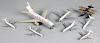 Eight small toy airplanes
